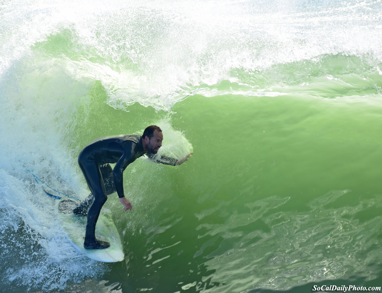 surfer on south side of Huntington Beach pier 1-24-11