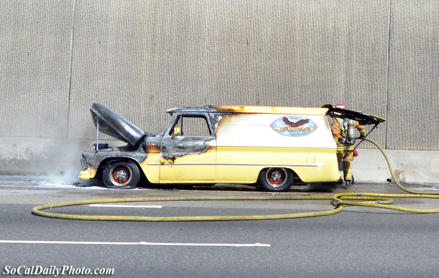 yellow delivery van on fire